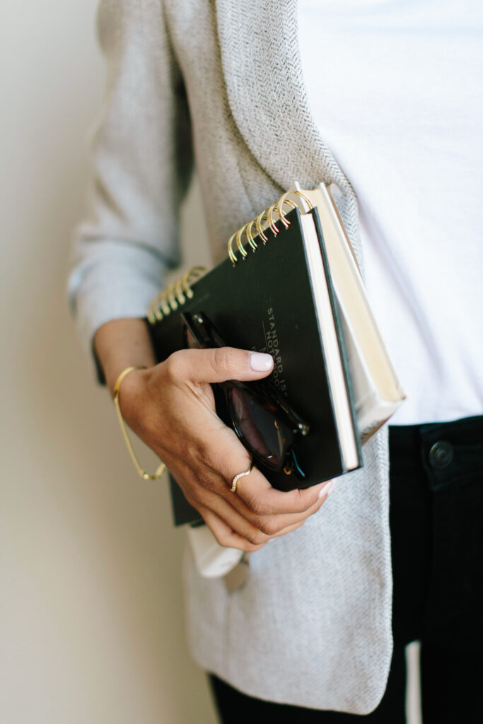 Woman holding a book.