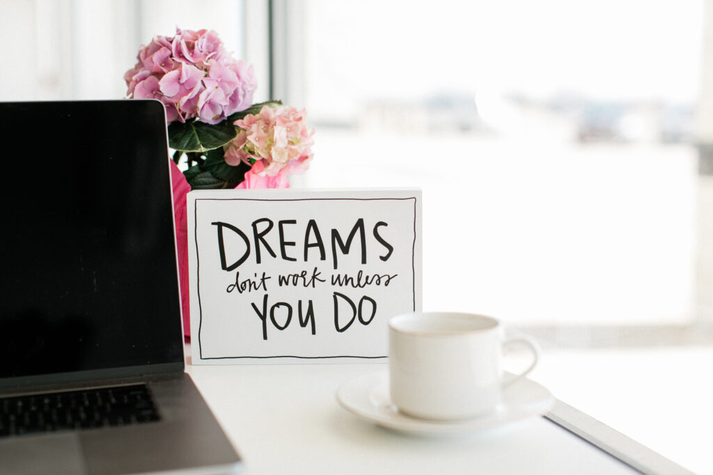 Frame with the phrase "Dreams don't work unless you do" in it